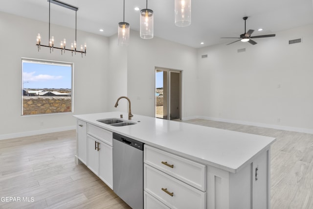 820 Acton St, Horizon City, TX 79928 - kitchen with dishwasher, a sink, plenty of natural light, light wood-type flooring, and recessed lighting