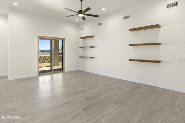 820 Acton St, Horizon City, TX 79928 - empty room with recessed lighting, a ceiling fan, light wood-style flooring, baseboards, and a towering ceiling