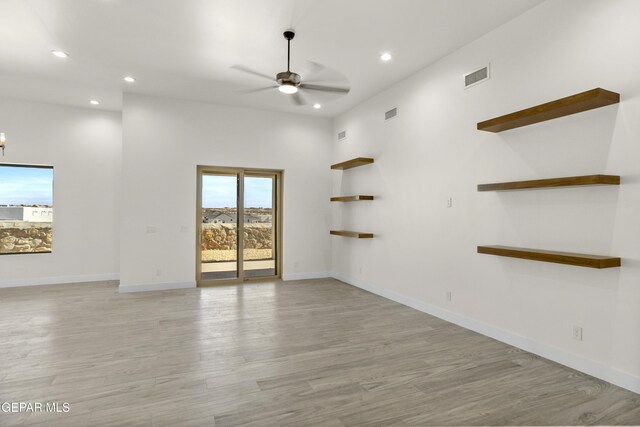 820 Acton St, Horizon City, TX 79928 - empty room with a ceiling fan, recessed lighting, light wood finished floors, and baseboards