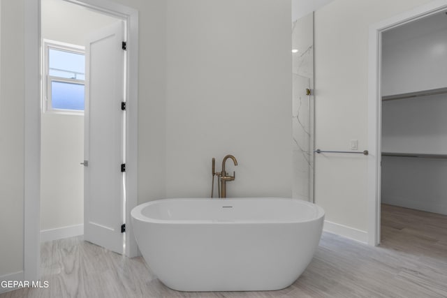 820 Acton St, Horizon City, TX 79928 - full bath featuring a freestanding bath, baseboards, and a marble finish shower