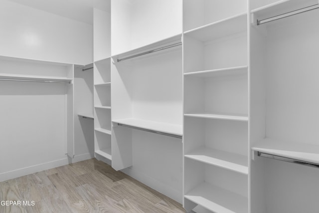 820 Acton St, Horizon City, TX 79928 - walk in closet featuring wood finished floors
