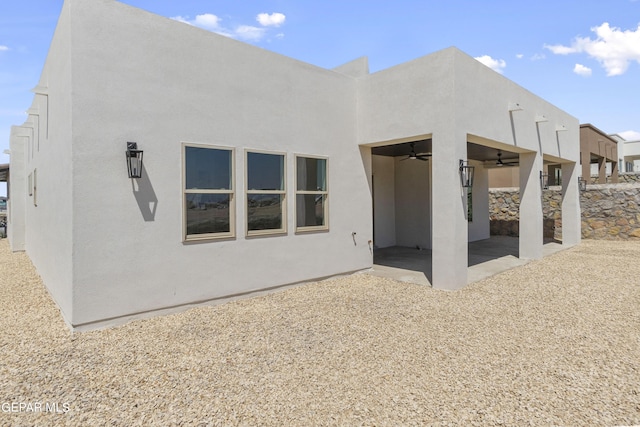 820 Acton St, Horizon City, TX 79928 - rear view of property featuring ceiling fan, stucco siding, and a patio