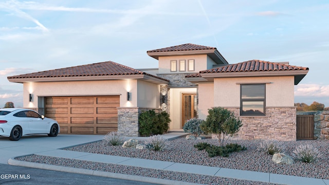 820 Acton St, Horizon City, TX 79928 - mediterranean / spanish-style home with stone siding, stucco siding, an attached garage, and driveway