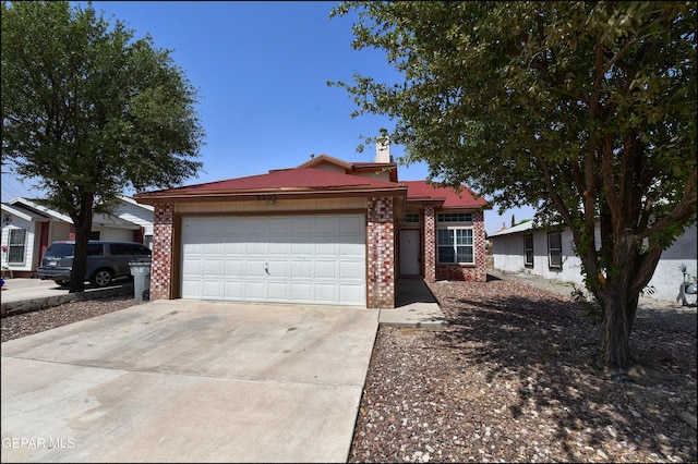6205 Alina Baltazar Dr, El Paso, TX 79932 - ranch-style house with concrete driveway, a garage, brick siding, and a chimney