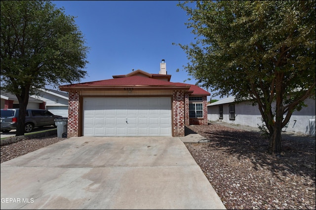 6205 Alina Baltazar Dr, El Paso, TX 79932 - ranch-style home featuring brick siding, driveway, a garage, and a chimney