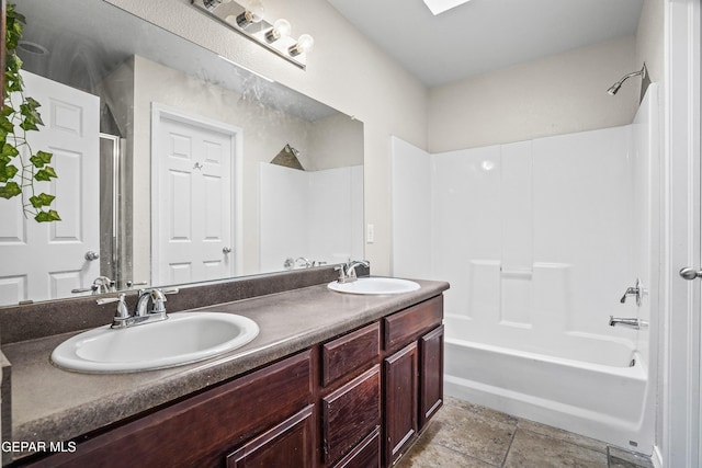 full bathroom with  shower combination and double vanity