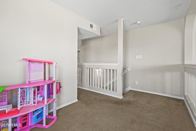 recreation room featuring carpet and baseboards