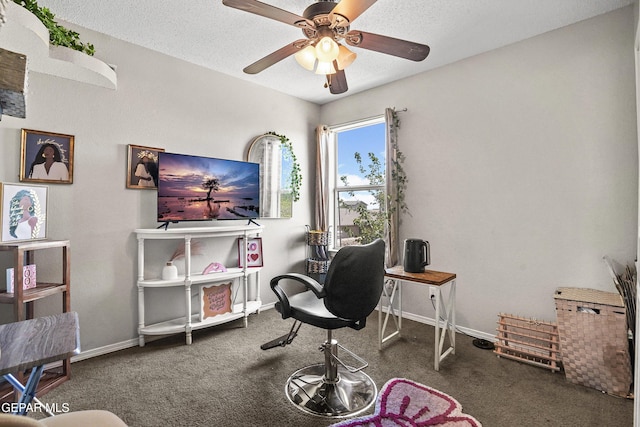 office with ceiling fan, carpet flooring, baseboards, and a textured ceiling