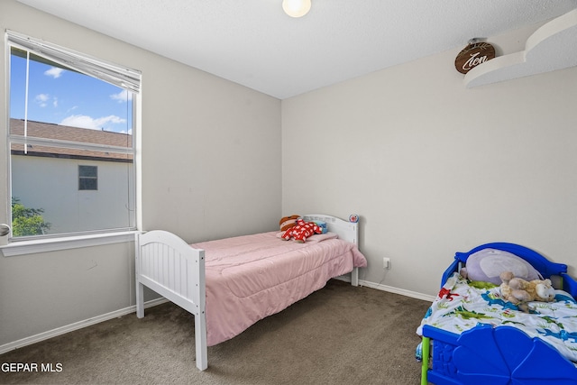 carpeted bedroom with baseboards