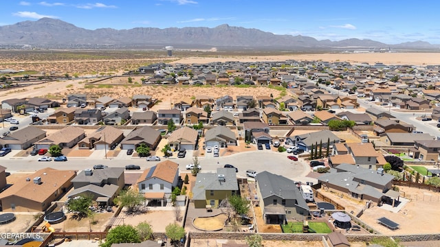 aerial view of residential area featuring a mountainous background