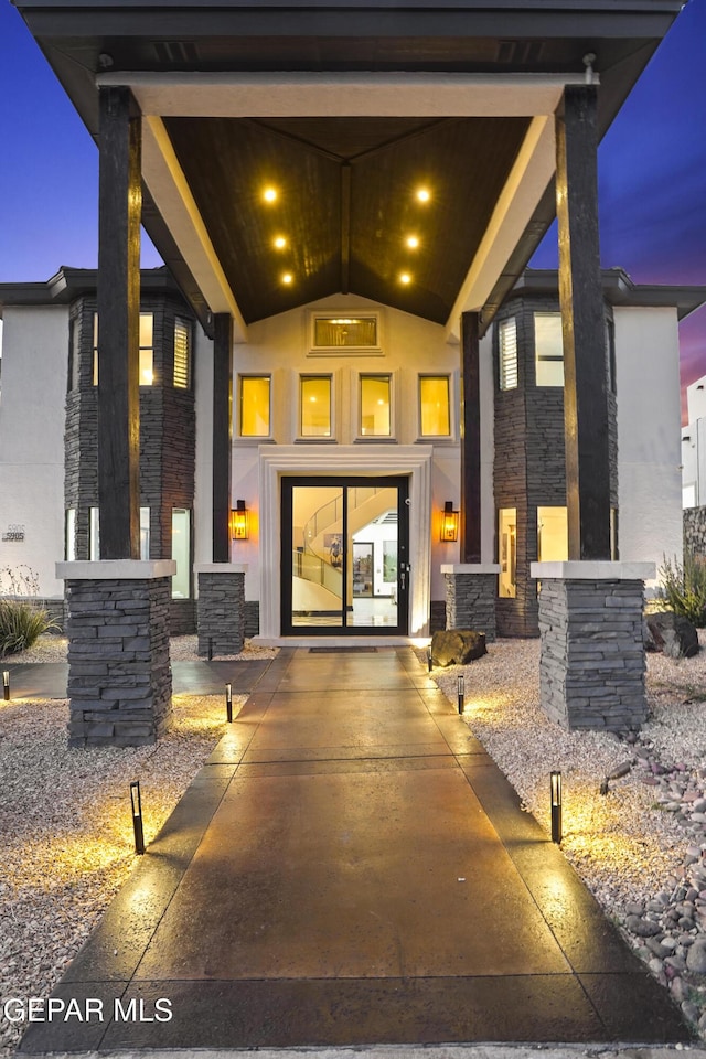 5905 Ojo De Agua Dr, El Paso, TX 79912 - doorway to property featuring stone siding