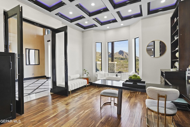 5905 Ojo De Agua Dr, El Paso, TX 79912 - living area with hardwood / wood-style floors, coffered ceiling, a high ceiling, beam ceiling, and baseboards