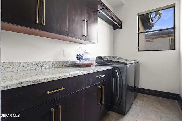 5905 Ojo De Agua Dr, El Paso, TX 79912 - washroom with cabinet space, independent washer and dryer, tile patterned flooring, and baseboards