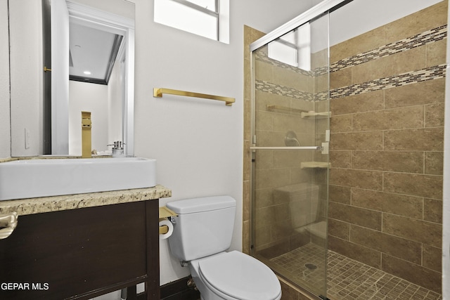 5905 Ojo De Agua Dr, El Paso, TX 79912 - full bathroom featuring a stall shower, toilet, and vanity