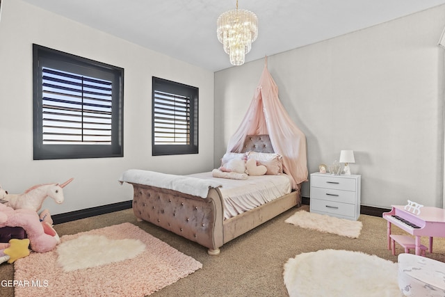 5905 Ojo De Agua Dr, El Paso, TX 79912 - carpeted bedroom featuring a chandelier and baseboards