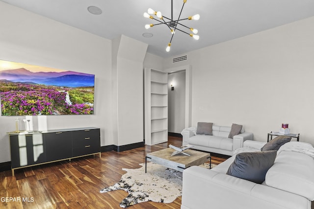 5905 Ojo De Agua Dr, El Paso, TX 79912 - living room with a chandelier, dark wood finished floors, and baseboards