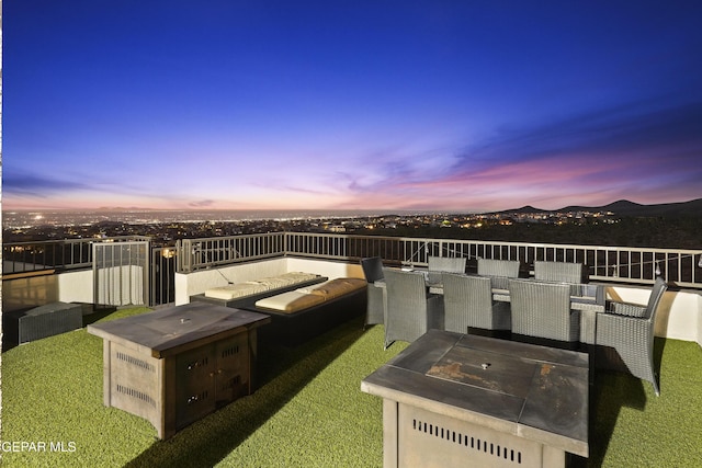 5905 Ojo De Agua Dr, El Paso, TX 79912 - patio terrace at dusk with a fire pit