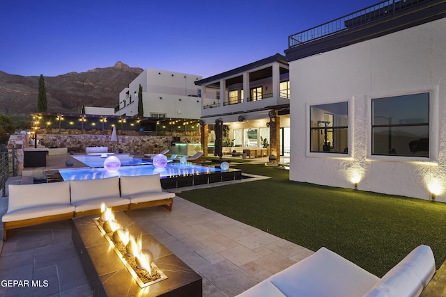 5905 Ojo De Agua Dr, El Paso, TX 79912 - swimming pool featuring a patio, a mountain view, and an outdoor living space with a fire pit