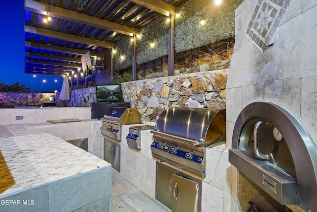 5905 Ojo De Agua Dr, El Paso, TX 79912 - view of patio / terrace featuring a grill and exterior kitchen