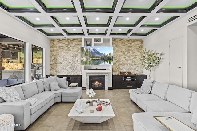 5905 Ojo De Agua Dr, El Paso, TX 79912 - living area with recessed lighting, coffered ceiling, beamed ceiling, and a lit fireplace