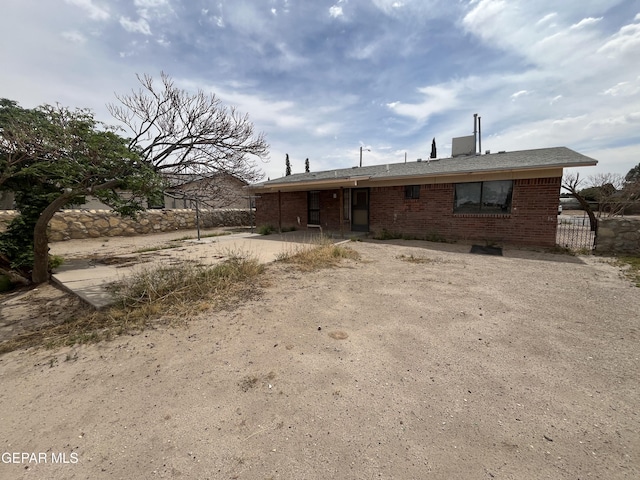 9885 Lilly Dr, El Paso, TX 79927 - rear view of house with brick siding