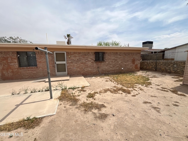 9874 Staubach Dr, El Paso, TX 79927 - back of house with brick siding and fence