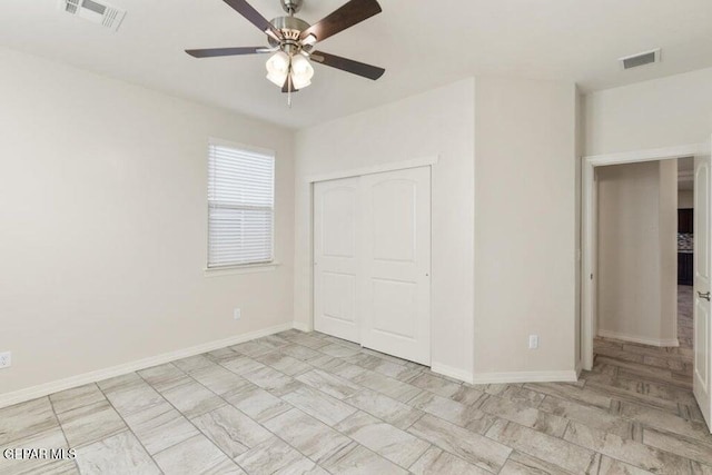 unfurnished bedroom featuring a closet, baseboards, and ceiling fan