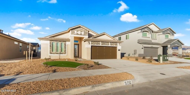 view of front facade featuring stucco siding, driveway, and an attached garage