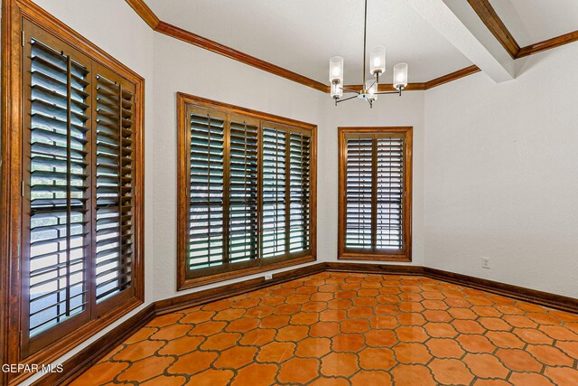 empty room with plenty of natural light, a chandelier, ornamental molding, tile patterned floors, and baseboards