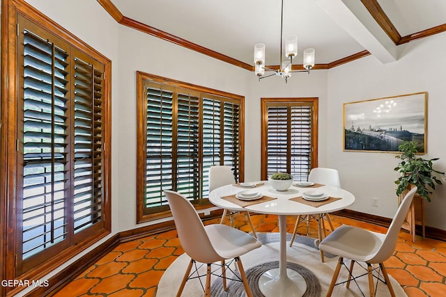 tiled dining area with crown molding, healthy amount of natural light, a chandelier, and baseboards