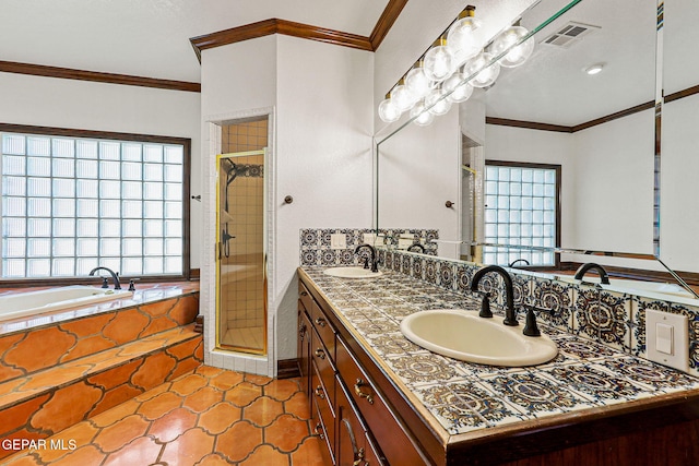 bathroom with ornamental molding, a shower stall, a bath, double vanity, and tile patterned flooring