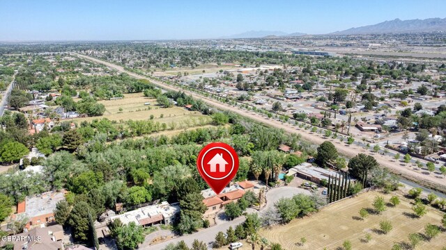 aerial view of property and surrounding area featuring mountains