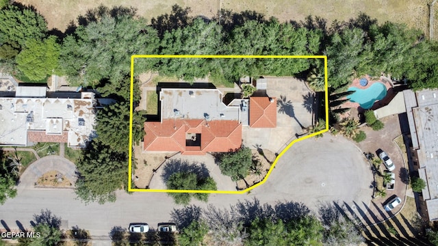 aerial overview of property's location with property boundaries highlighted and a pool