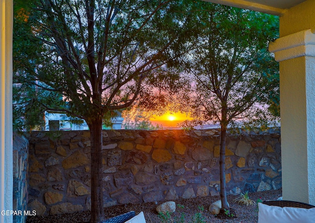 view of patio terrace at dusk