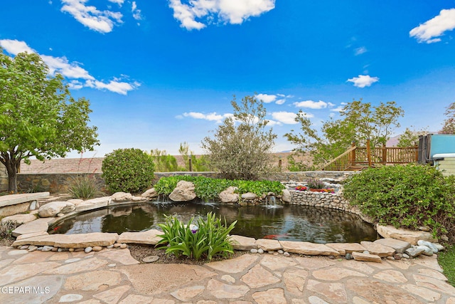 view of yard with a garden pond