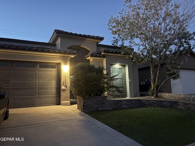 14233 Richard Wiles Ave, El Paso, TX 79938 - mediterranean / spanish-style home with stucco siding, a tile roof, concrete driveway, and an attached garage