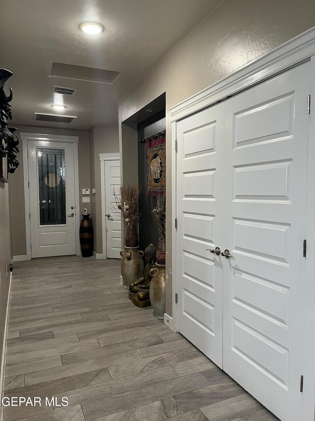 14233 Richard Wiles Ave, El Paso, TX 79938 - hallway featuring light wood-type flooring and baseboards