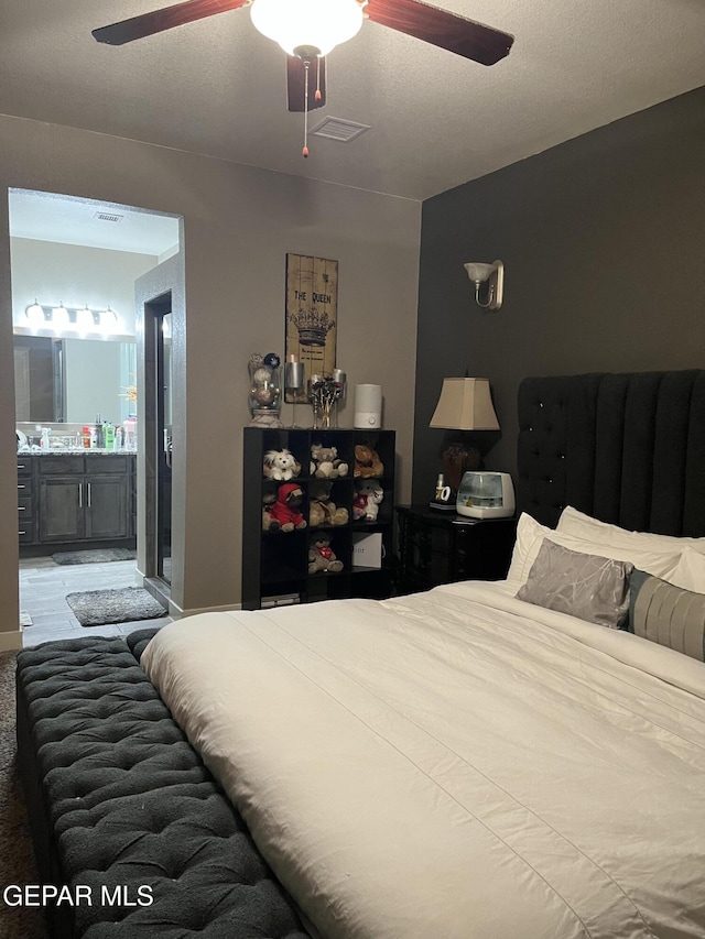 14233 Richard Wiles Ave, El Paso, TX 79938 - bedroom featuring connected bathroom and a ceiling fan