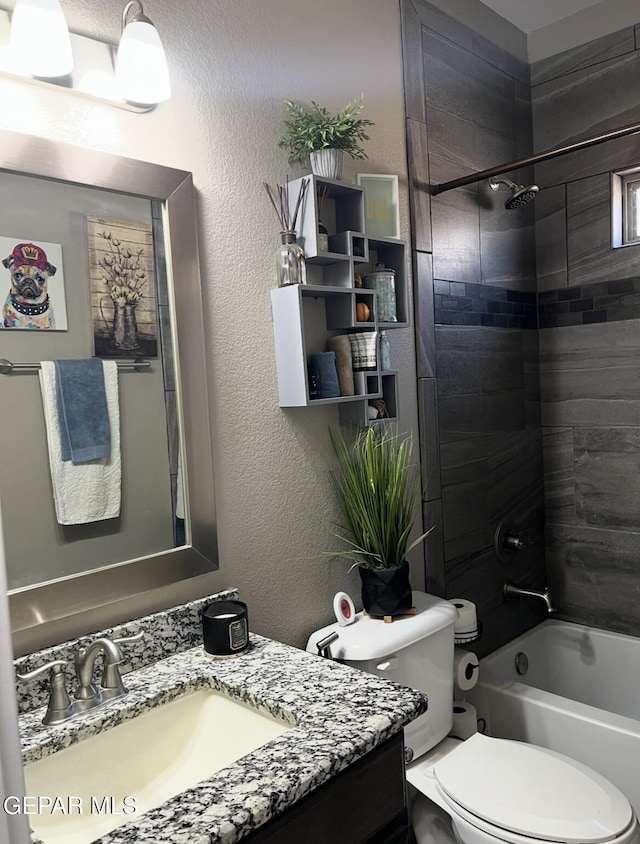 14233 Richard Wiles Ave, El Paso, TX 79938 - full bathroom featuring vanity, toilet, shower / tub combination, and a textured wall