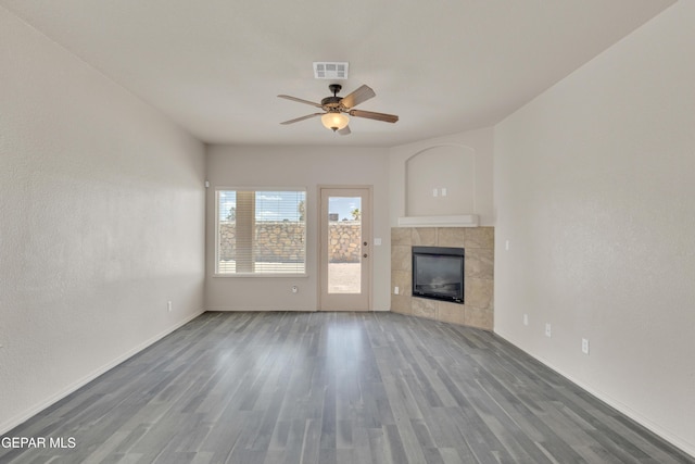 13824 Hollywood Dr, Horizon City, TX 79928 - unfurnished living room featuring ceiling fan, wood finished floors, and baseboards