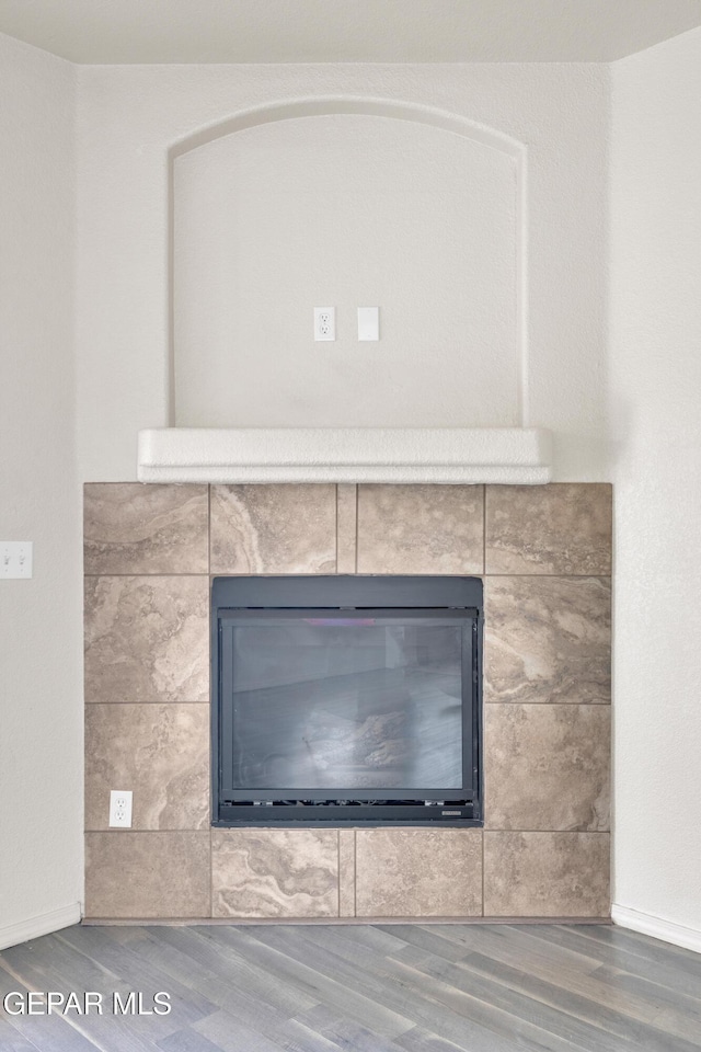 13824 Hollywood Dr, Horizon City, TX 79928 - detailed view of wood finished floors and a fireplace