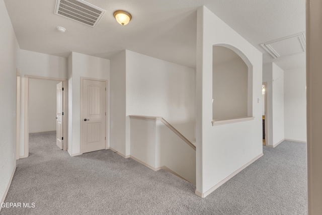 13824 Hollywood Dr, Horizon City, TX 79928 - corridor with carpet flooring, an upstairs landing, baseboards, and attic access