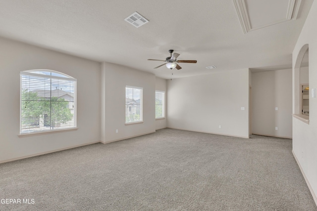 13824 Hollywood Dr, Horizon City, TX 79928 - unfurnished room with light carpet, a ceiling fan, attic access, and baseboards