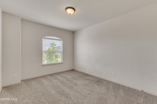 13824 Hollywood Dr, Horizon City, TX 79928 - carpeted empty room with baseboards