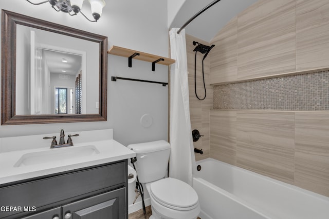 full bath featuring toilet, shower / bath combination with curtain, and vanity