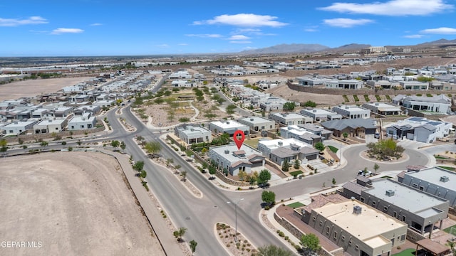 view of property location with a mountainous background and nearby suburban area