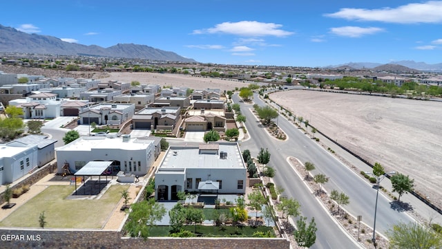 aerial view of residential area with mountains