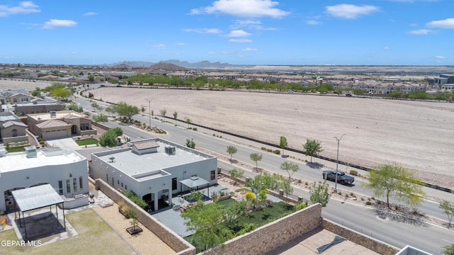 aerial view of residential area featuring mountains