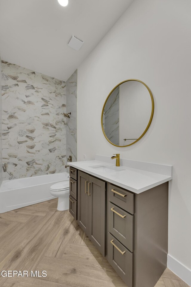 429 Lesa Ln, El Paso, TX 79915 - bathroom featuring toilet, vaulted ceiling, vanity, and tub / shower combination