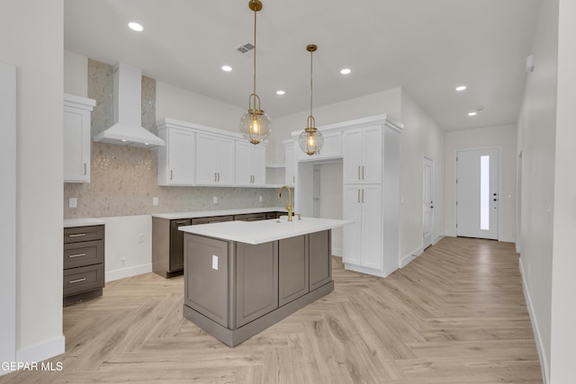 429 Lesa Ln, El Paso, TX 79915 - kitchen featuring wall chimney exhaust hood, white cabinetry, baseboards, backsplash, and recessed lighting